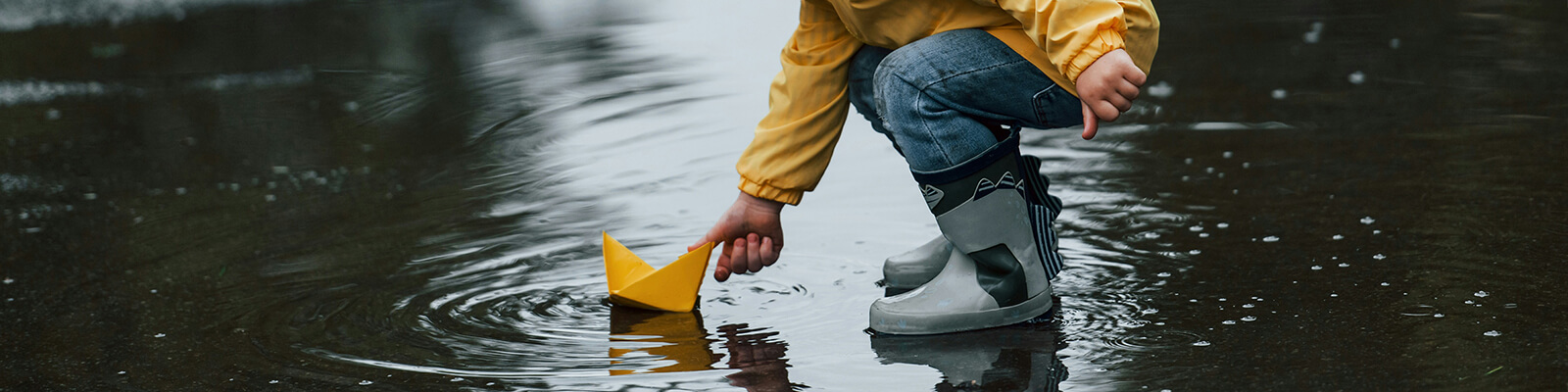 Child Playing in Rain