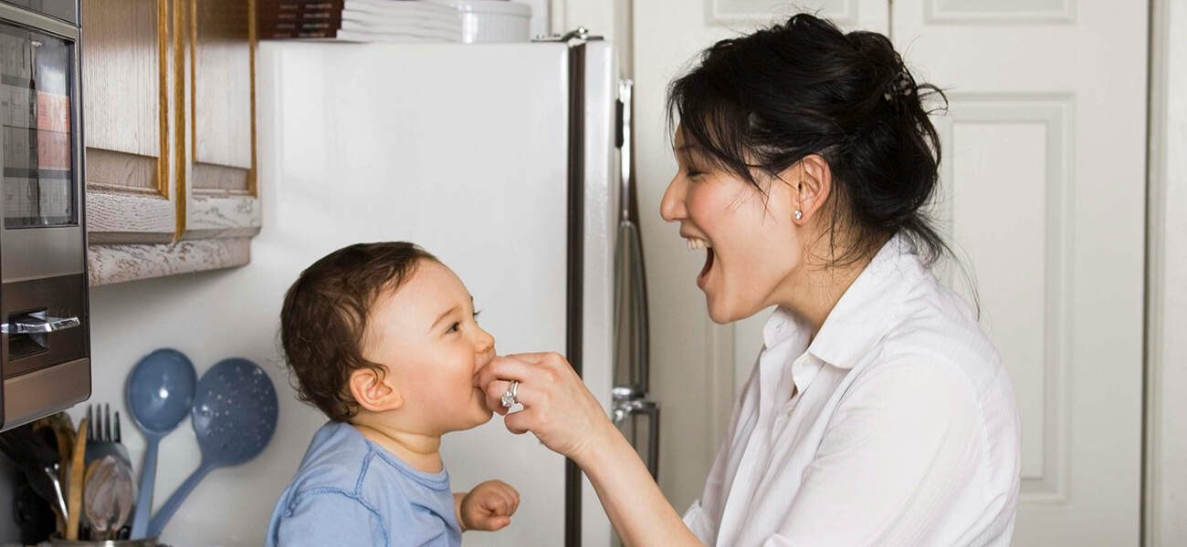 Lasting Action - Mother feeding child