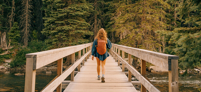 Movement Matters child walking across bridge